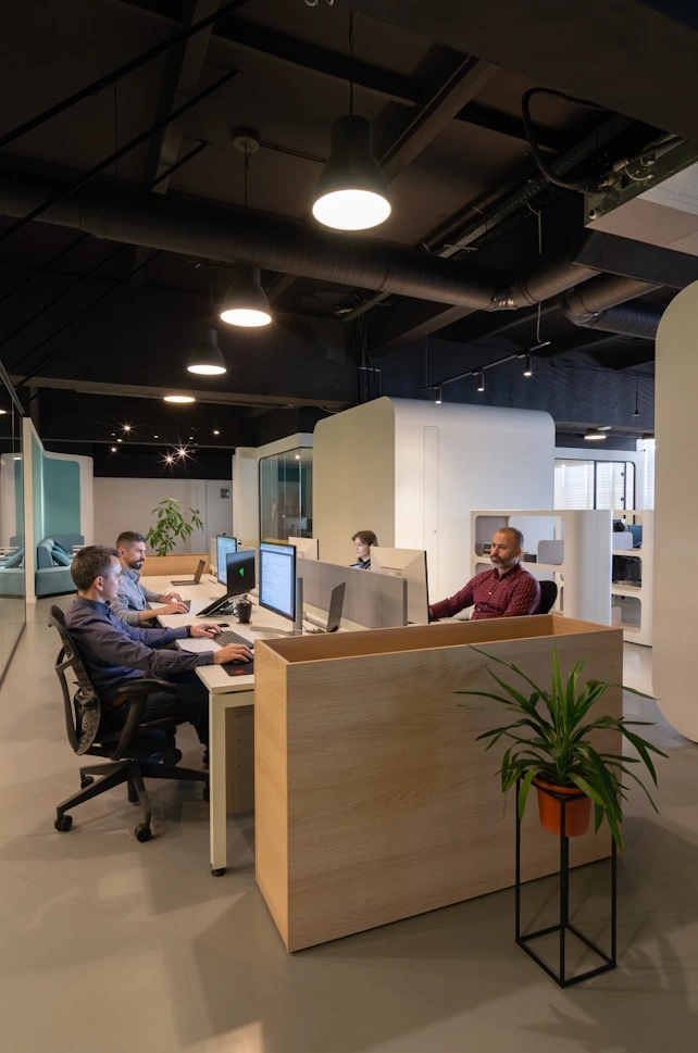 Developers working at desks in an open-plan studio
